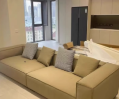 Minimalist Beige Upholstered Three-Seater Sofa